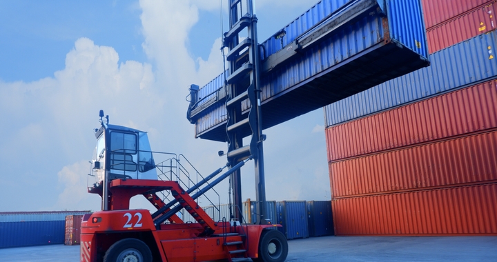 Forklift placing containers that will be filled at the container freight station when shipping with Shipa Freight