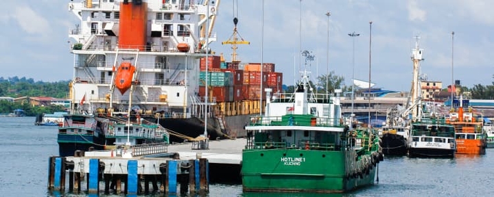 Cargo ship at doc next to other ships