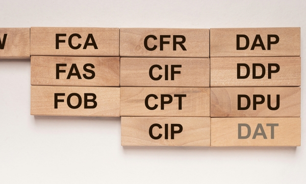 Wooden blocks showing the different Incoterms to represent the best Incoterms to choose when shipping to China.