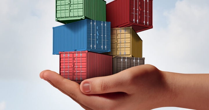 Hand holding containers to represent cargo insurance with Shipa Freight
