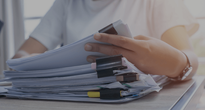 Person going through documents to represent the different shipping documents with Shipa Freight