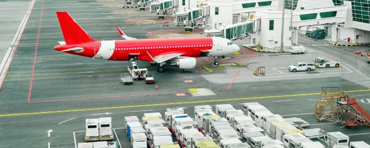 Air cargo being loaded on airplane while at the airport