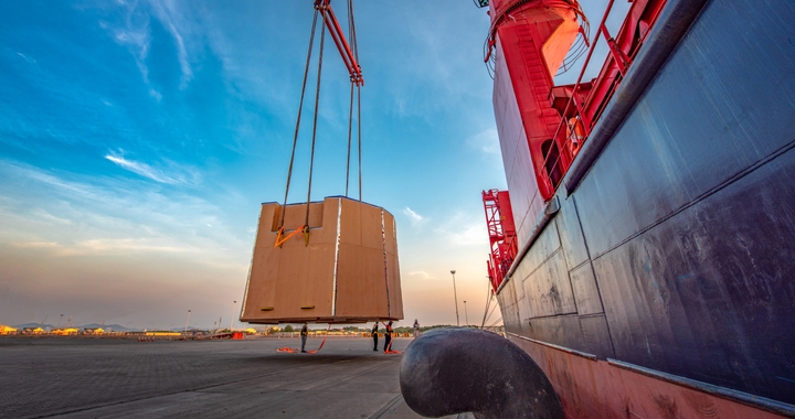 Heavy and oversized cargo being loaded on a cargo ship with Shipa Freight