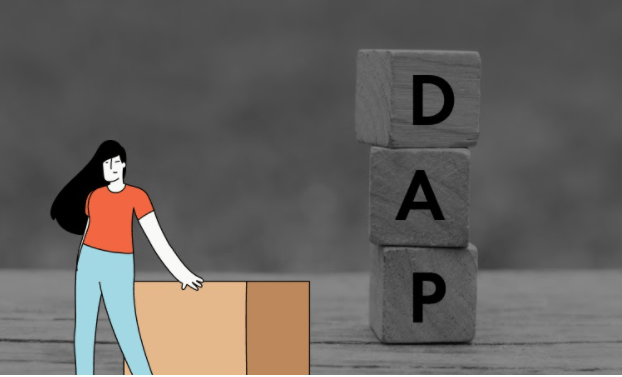 Person standing next cubes spelling DAP for the Incoterm Delivered at Place when shipping with Shipa Freight.