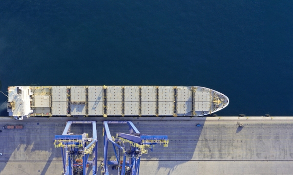 Cargo ship getting loaded at port for international shipping with Shipa Freight