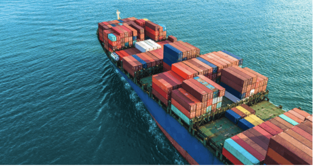 Containers systematically stacked on their way to be shipped through the means of ocean freight