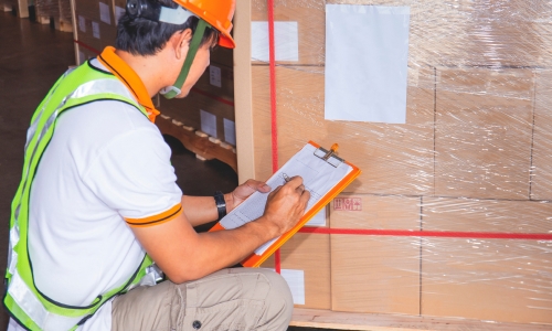 Warehouse worker checking packing for Shipa Freight