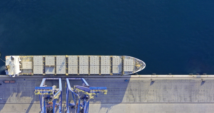 Cargo ship getting loaded at port for international shipping with Shipa Freight